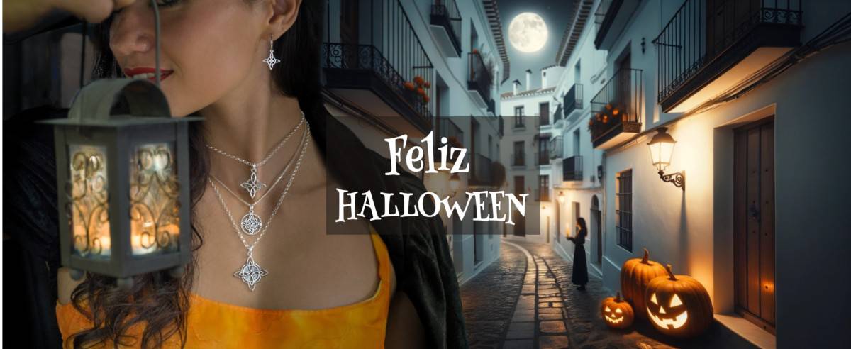 Pueblo típico español invadido por adornos de Hallowen y con una persona en primer plano que muestra unas joyas Nudo de Bruja. Feliz Halloween